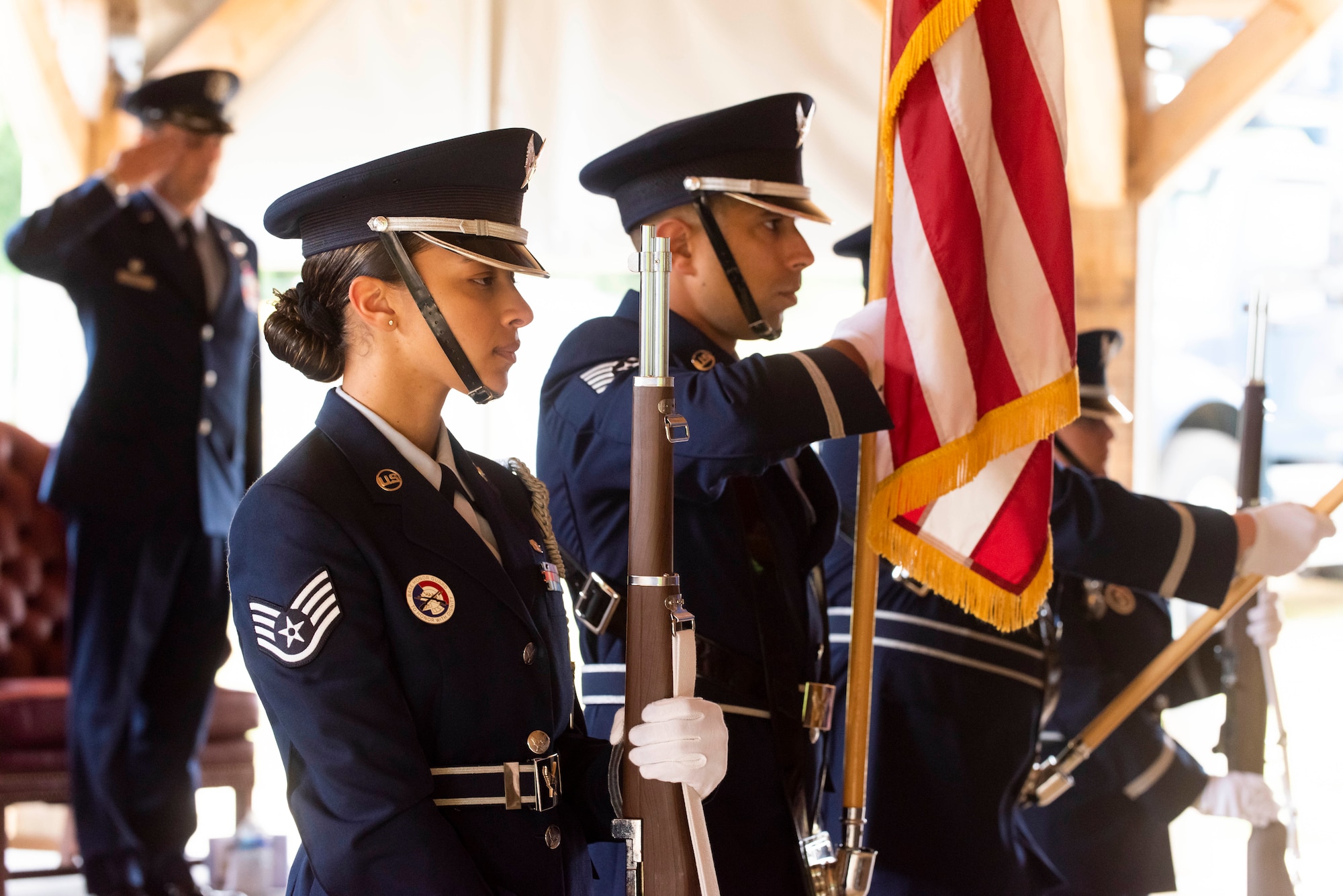 The 422nd Air Base Group base honor guard present the colors during a change of command ceremony at RAF Croughton, England, July 20, 2022. The ceremony is a military tradition that represents a formal transfer of a unit’s authority and responsibility from one commander to another. (U.S. Air Force photo by Senior Airman Jennifer Zima)