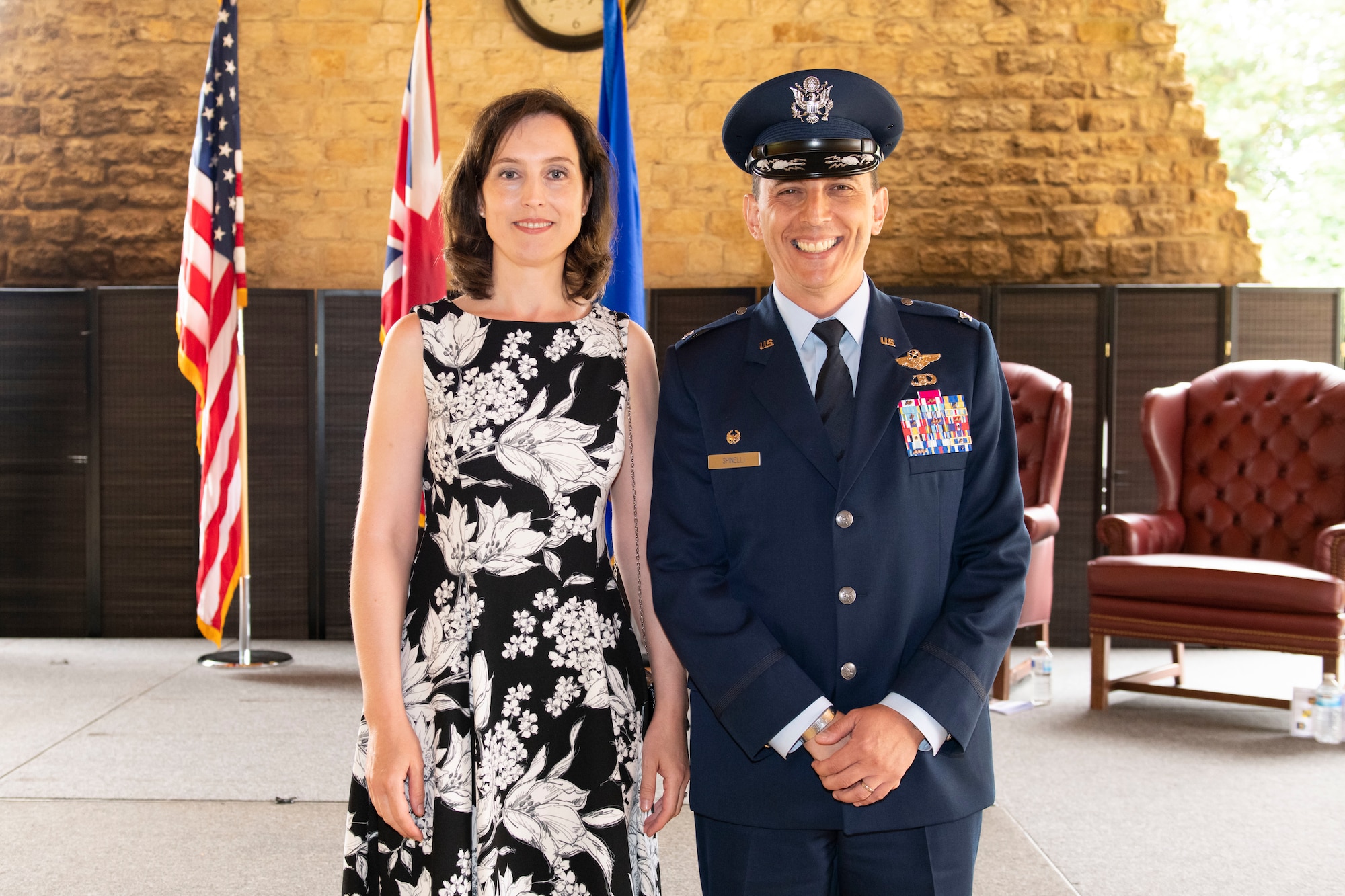 U.S. Air Force Col. Edward Spinelli, 422nd Air Base Group commander, poses for a photo with his spouse, Astrid Spinelli, after a change of command ceremony at RAF Croughton, England, July 20, 2022. The ceremony is a military tradition that represents a formal transfer of a unit’s authority and responsibility from one commander to another. (U.S. Air Force photo by Senior Airman Jennifer Zima)