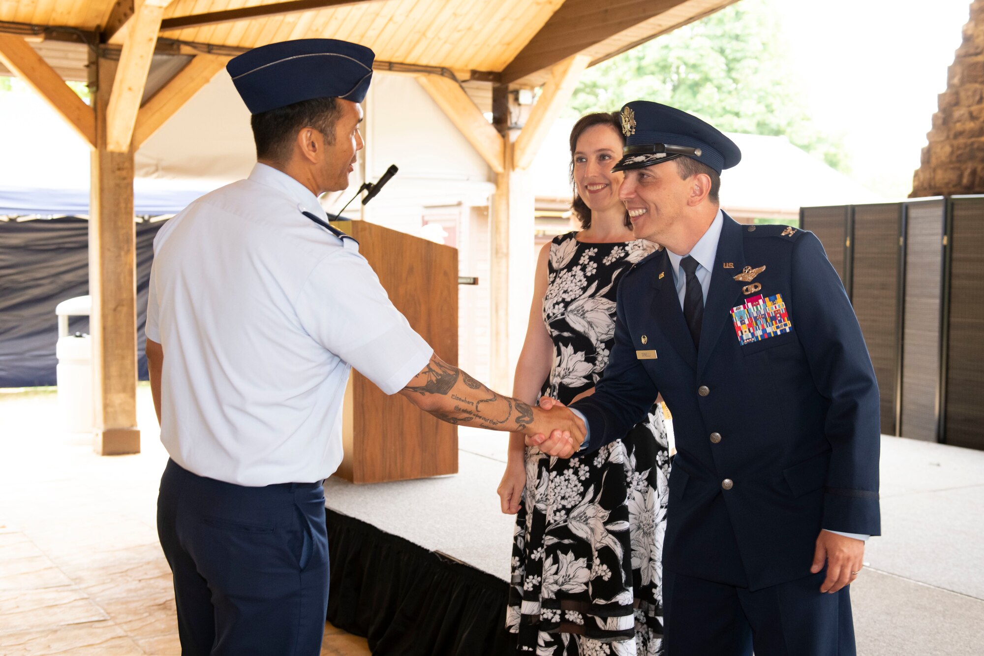 U.S. Air Force Maj. Jethro Sadorra, left, 422nd Civil Engineer Squadron commander, greets Col. Edward Spinelli, 422nd Air Base Group commander, and his spouse, Astrid Spinelli, after a change of command ceremony at RAF Croughton, England, July 20, 2022. The ceremony is a military tradition that represents a formal transfer of a unit’s authority and responsibility from one commander to another. (U.S. Air Force photo by Senior Airman Jennifer Zima)