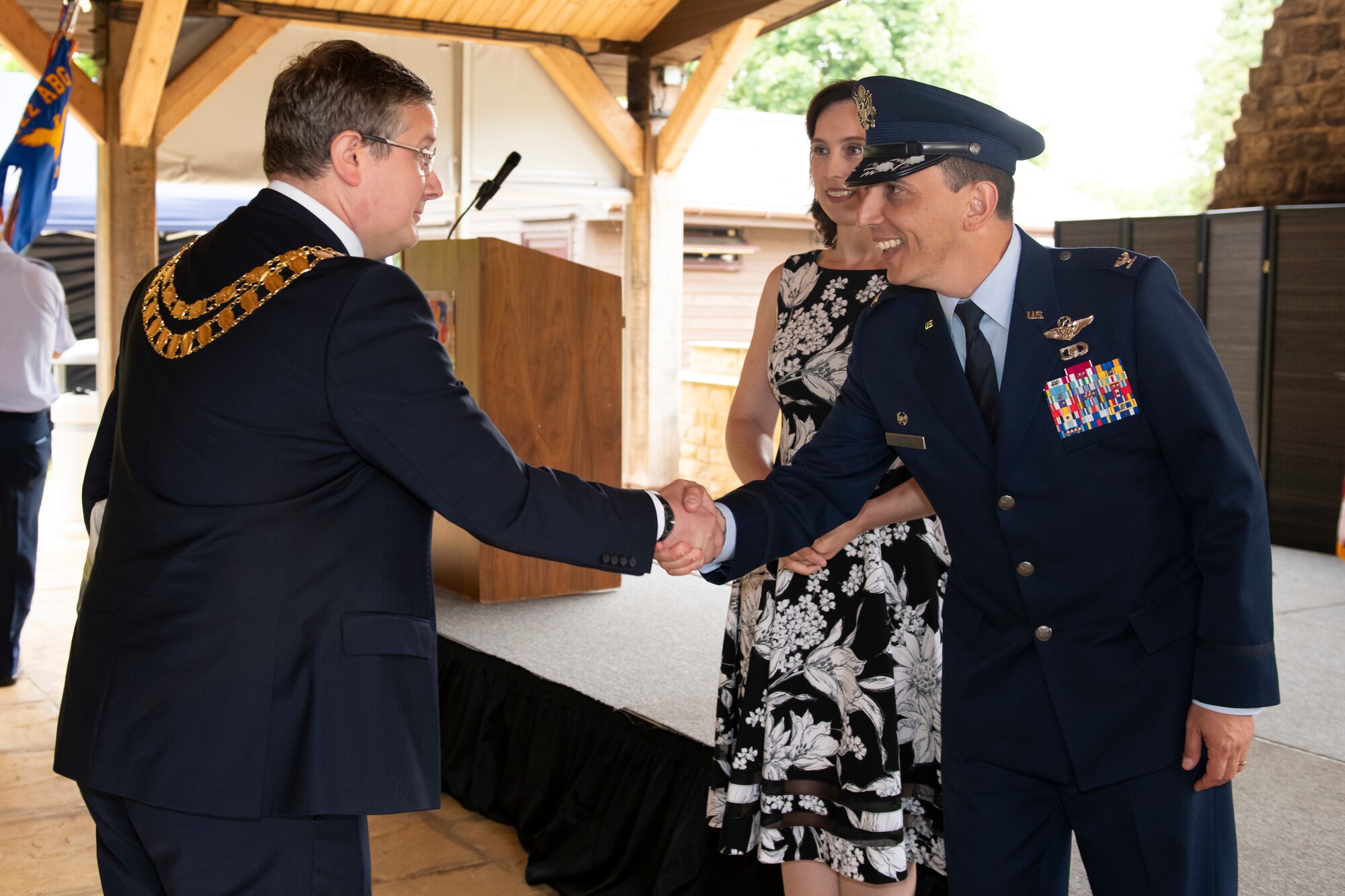 U.S. Air Force Col. Edward Spinelli, 422nd Air Base Group commander, greets a guest after a change of command ceremony at RAF Croughton, England, July 20, 2022. The ceremony is a military tradition that represents a formal transfer of a unit’s authority and responsibility from one commander to another. (U.S. Air Force photo by Senior Airman Jennifer Zima)