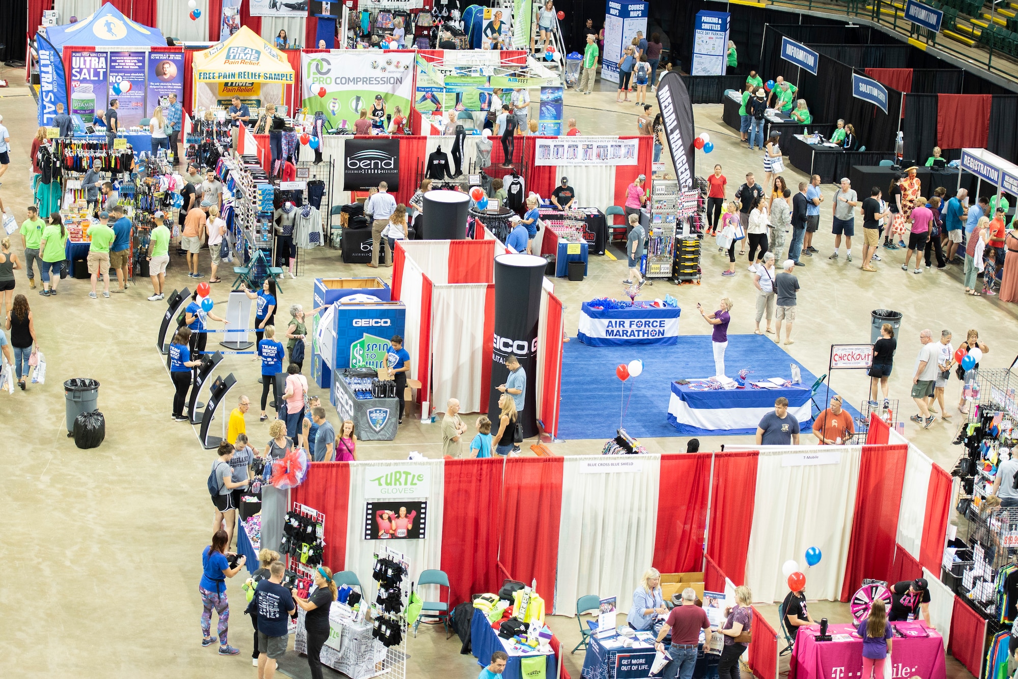 2019 U.S. Air Force Marathon fitness expo attendees check out vendor booths inside the Wright State University Nutter Center in Fairborn, Ohio, Sept. 20, 2019. The two day expo allowed runners to pick up their runners bib and any last minute gear needed for the race. (U.S. Air Force photo by Wesley Farnsworth)