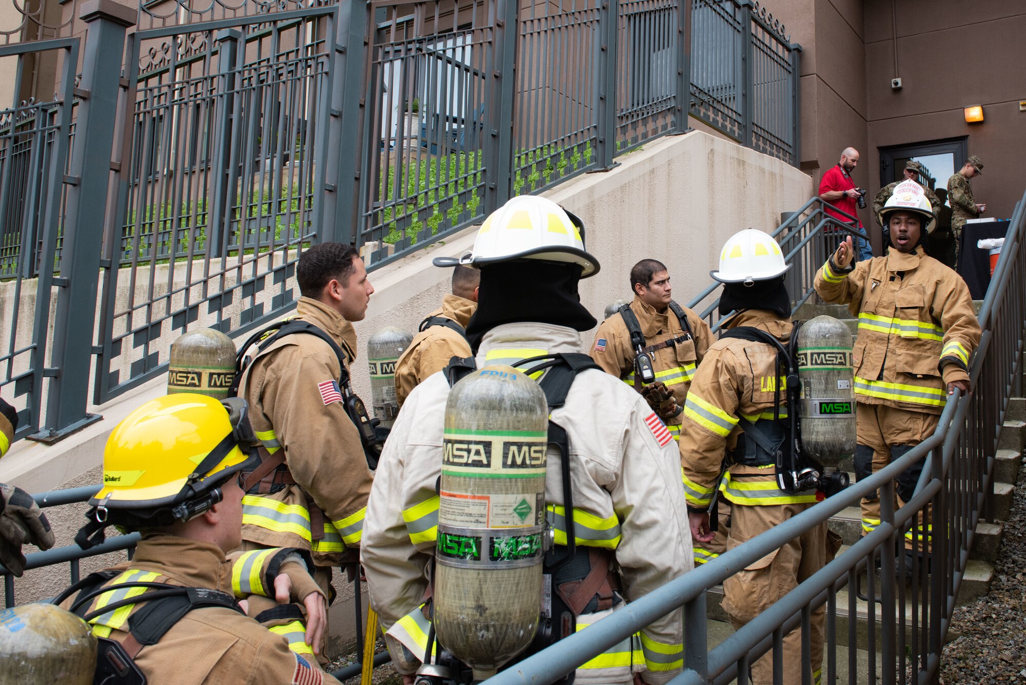 Participants receive directions for the annual stair climb challenge as part of the 9/11  Remembrance Ceremony at Osan Air Base, Republic of Korea, Sept. 10, 2022.