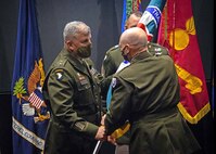 Maj. Gen. Tom O'Connor, Jr. receives flag.