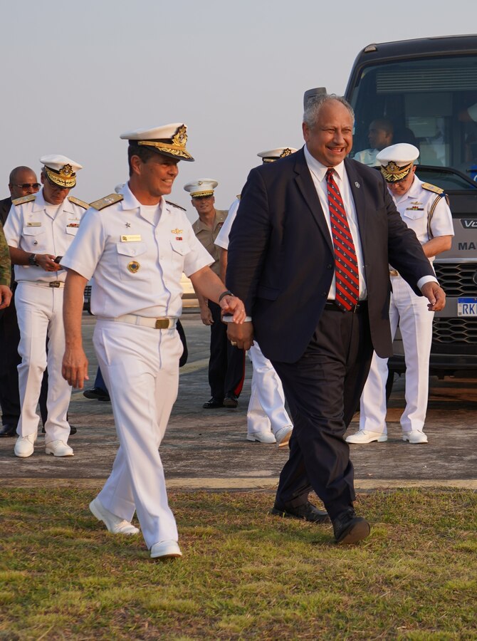 Vice-Almirante Chagas Vianna Braga (Vice Admiral Brazilian Marine Corps), left, Brazilian fleet marine force commander, escorts U.S. Secretary of the Navy Carlos Del Toro, right, to the reviewing stand to observe a multinational amphibious assault demonstration at Ilha do Governador, Rio de Janeiro, on the official opening day of UNITAS LXIII, Sept. 8, 2022. For the last 63 year, UNITAS has developed and sustained relationships that improve the capacity of our reemerging and enduring maritime partners to achieve common objectives. Additionally, the military-to-military exchanges foster friendly, mutual cooperation and understanding among participating navies and marine corps. (U.S. Marine Corps photo by Maj. Jeremy Wheeler)