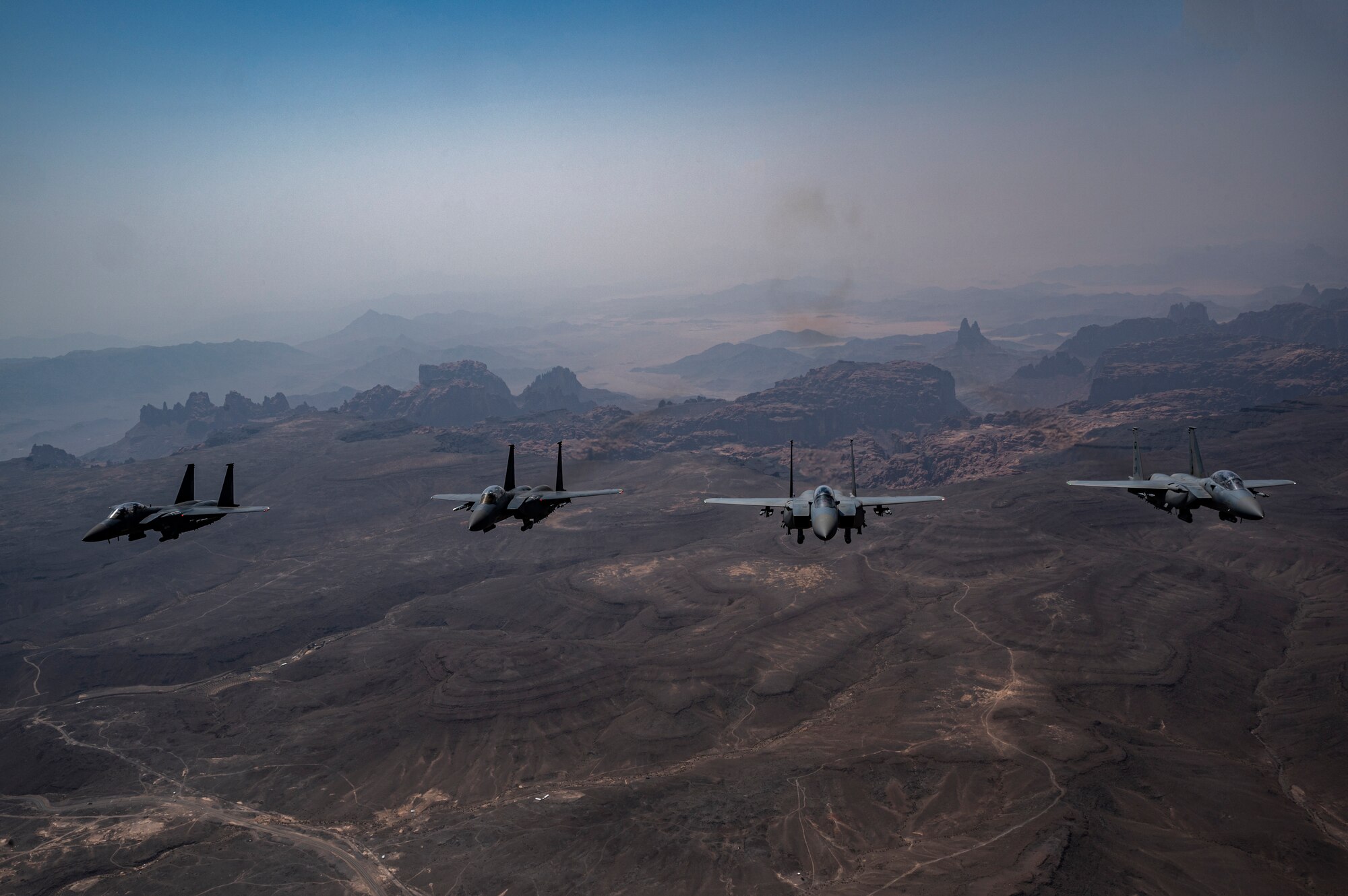 U.S. Air Force F-15E Strike Eagles, assigned to the 335th Expeditionary Fighter Squadron, fly alongside Saudi Arabian Air Force F-15E Strike Eagles during Operation Agile Spartan III within the U.S. Central Command area of responsibility, Sep. 5, 2022. OAS III tested Ninth Air Force (Air Forces Central)’s ability to execute rapid troop and equipment movement to and from dispersed locations around the U.S. Central Command area of responsibility region. This kind of joint training enhances international partnership and interoperability in the interest of regional security. (U.S. Air Force photo by Staff Sgt. Christian Sullivan)