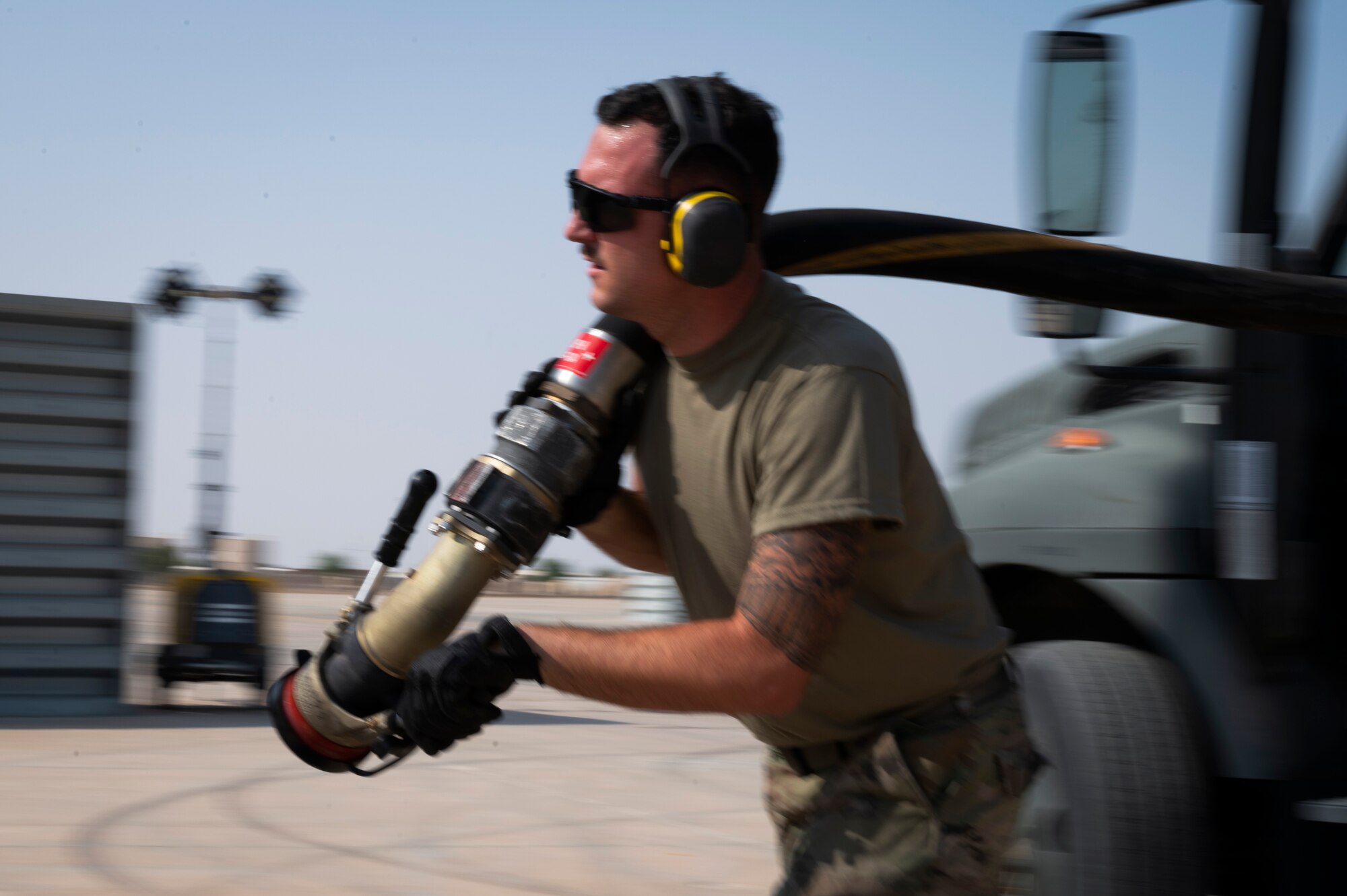 U.S. Air Force Senior Airman Anthony Colobro, 386th Logistics Readiness Squadron fuels distribution operator, runs a fuel line to an F-16CM Fighting Falcon during Operation Agile Spartan III at an undisclosed location, September 10, 2022. This exercise tested how Airmen can demonstrate their Agile Combat Employment capabilities, deploying a small and efficient team anywhere in the world, at any time, to stand up a functioning air base and necessary facilities to a mission capable status as quickly as possible