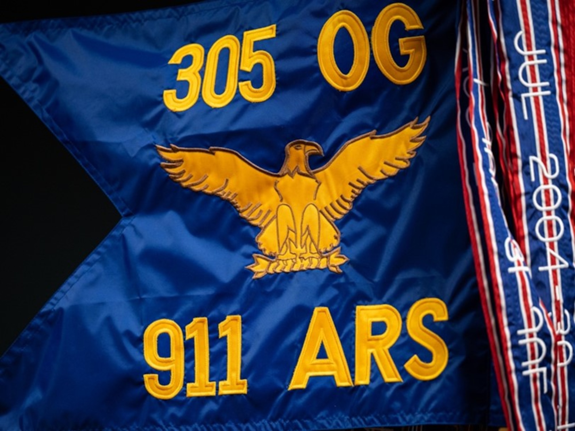 A 911th Air Refueling Squadron guidon is displayed at Seymour Johnson Air Force Base, North Carolina, Sept. 9, 2022. The squadron is the Air Force's very first active-duty squadron that is under the command of a reserve wing.