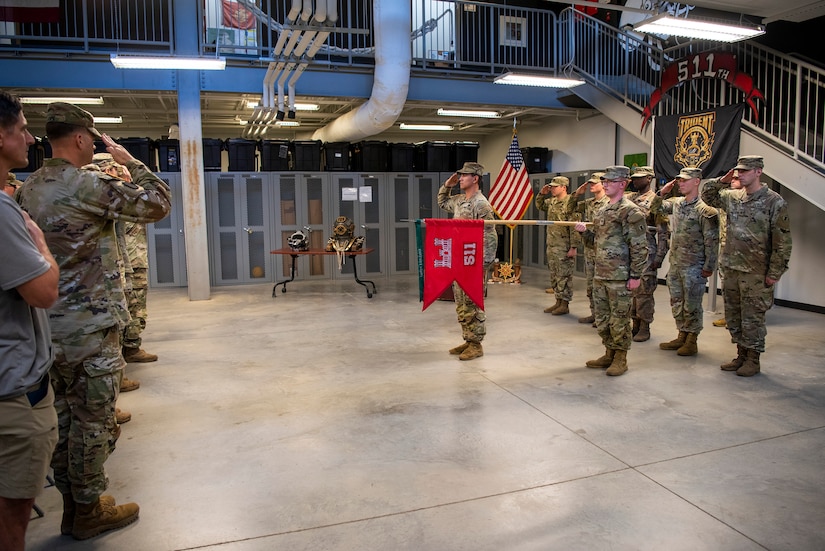 U.S. Army divers of the 511th Engineer Dive Detachment render honors during a pre-deployment ceremony at Joint Base Langley-Eustis, Virginia, September 9, 2022.