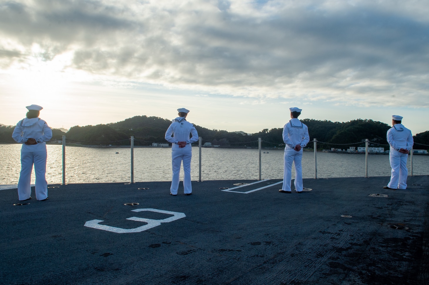 220912-N-IG750-1057 YOKOSUKA, Japan (Sept. 12, 2022) Sailors man the rails on the flight deck aboard the U.S. Navy’s only forward-deployed aircraft carrier, USS Ronald Reagan (CVN 76), as the ship departs Commander, Fleet Activities Yokosuka, Sept. 12. Ronald Reagan, the flagship of Carrier Strike Group 5, provides a combat-ready force that protects and defends the United States, and supports alliances, partnerships and collective maritime interests in the Indo-Pacific region. (U.S. Navy photo by Mass Communication Specialist 2nd Class Caleb Dyal)