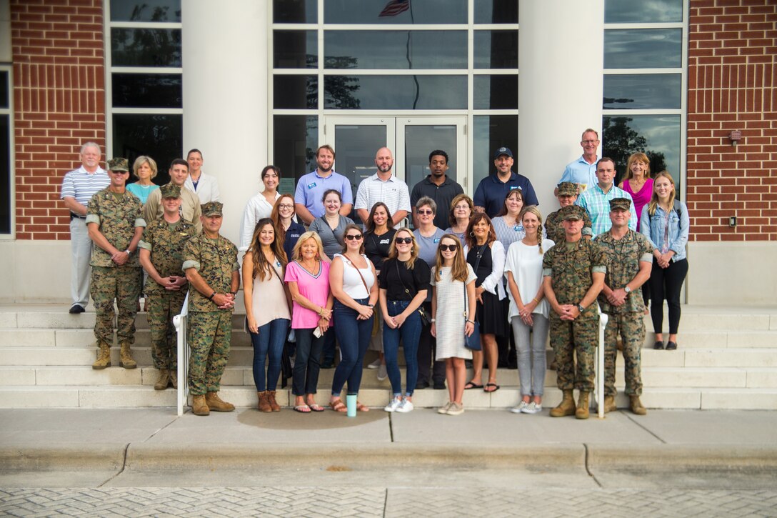 Leadership Craven Class of 2022 poses for a photo with leadership personnel

on Marine Corps Air Station (MCAS) Cherry Point, North Carolina, Sept. 8,

2022. This annual program is run by the New Bern Area Chamber of Commerce

and gives local leaders, business owners, and professionals knowledge of the

economic and social impact of their neighboring Marine Corps installation.

(U.S. Marine Corps. photo by Lance Cpl. Tristen Reed)