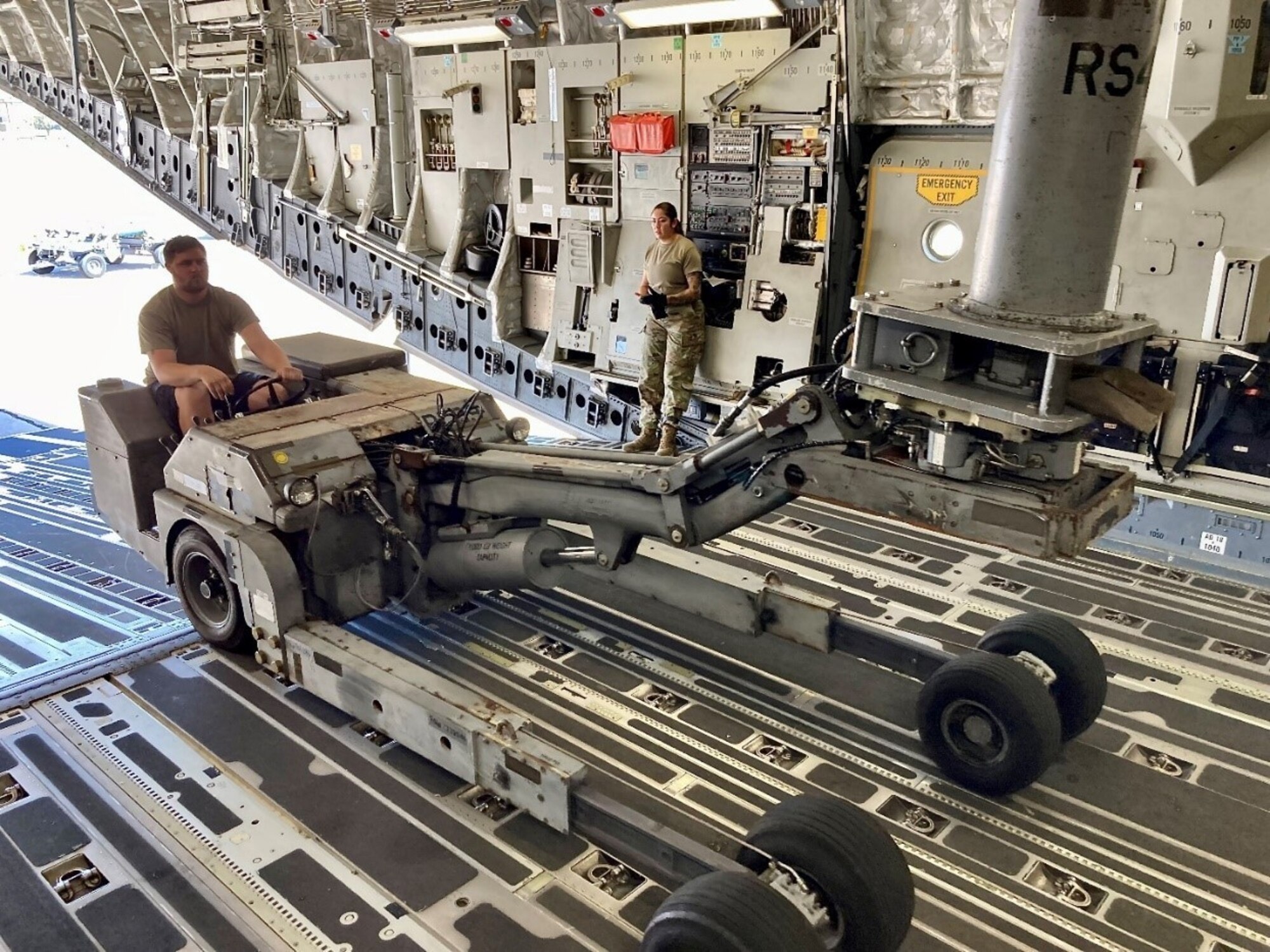 Staff Sgt. Jon Belk, reservist from the 489 BG drives a bomb lift truck onto a C-17 Sep. 9, 2022 in preparation for Exercise Baked Alaskan. (Courtesy Photo)