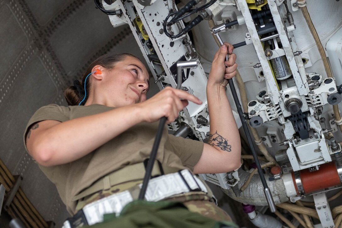 Senior Airman Makayla Singer, 28th Aircraft Maintenance Squadron load crew member, prepares a munitions rack at Ellsworth Air Force Base, S.D., Aug. 24, 2022. The 28th Bomb Wing’s integration into the U.S. Navy live-fire mine exercise helped the Navy strengthen naval mine tactics, techniques, and procedures. (U.S. Air Force photo by Senior Airman Quentin K. Marx)
