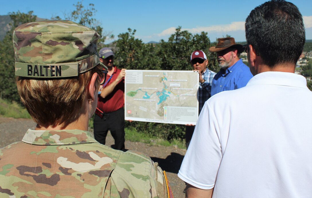 Col. Julie Balten, Los Angeles District commander, and Michael Connor, Assistant Secretary of the Army for Civil Works, discuss the Rio de Flag Flood Control Project with City of Flagstaff leaders Aug. 31 in Flagstaff, Arizona. According to Jim McCarthy, city council member, not pictured, the project will prevent flooding of important downtown, residential and Northern Arizona University property. (Photo by Robert DeDeaux, Los Angeles District PAO)