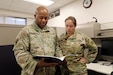 Maj. Timothy Booker, left, and Maj. Rebecca Spohr look over a document at the 85th U.S Army Reserve Support Command’s Inspector General office, September 11, 2022. During their September battle assembly, Booker reflected on why he chose to serve more than 20 years ago, following the terrorist attacks on September 11, 2001.
(U.S. Army Reserve photo by Staff Sgt. David Lietz)