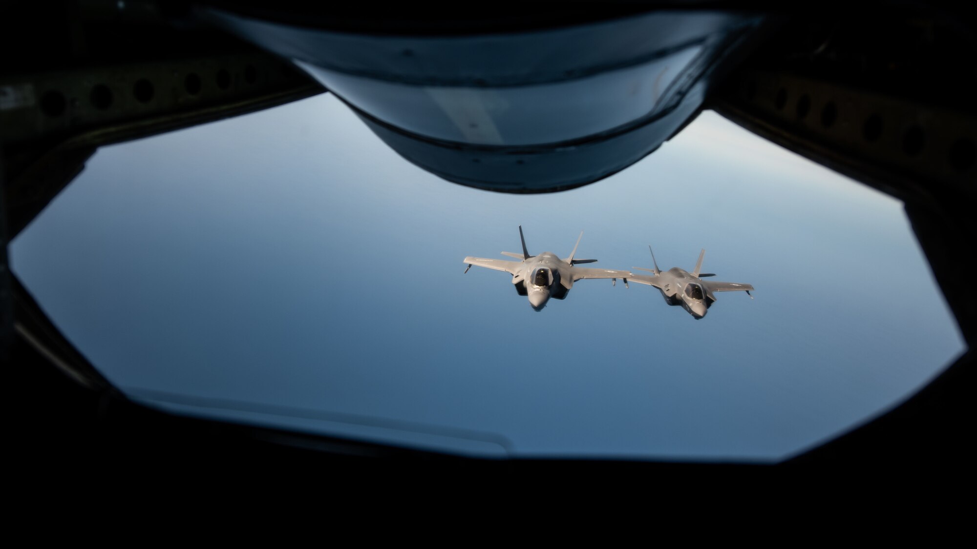Two F-35s fly next to each other