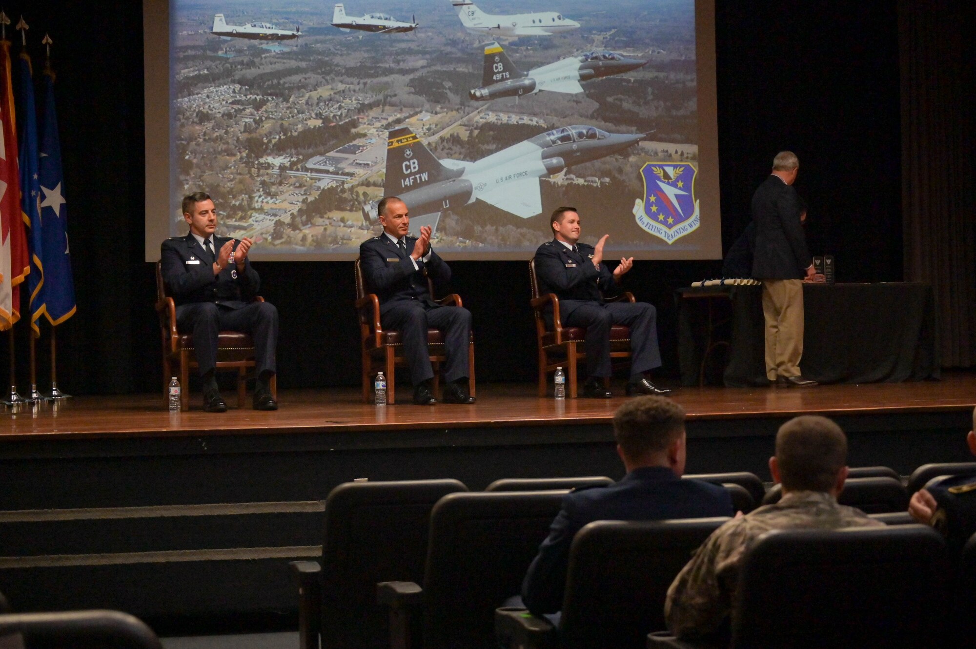 Lt. Gen. Scott Pleus (center), Deputy Commander, U.S. Forces Korea; Commander, Air Component Command, United Nations Command; Commander, Air Component Command, Combined Forces Command; and Commander, Seventh Air Force, Pacific Air Forces, Osan Air Base, South Korea, applauds Specialized Undergraduate Pilot Training Class 22-15 during the classes graduation ceremony, Sept 9, 2022, on Columbus Air Force Base, Miss. (U.S. Air Force photo by Staff Sgt. Jake Jacobsen)