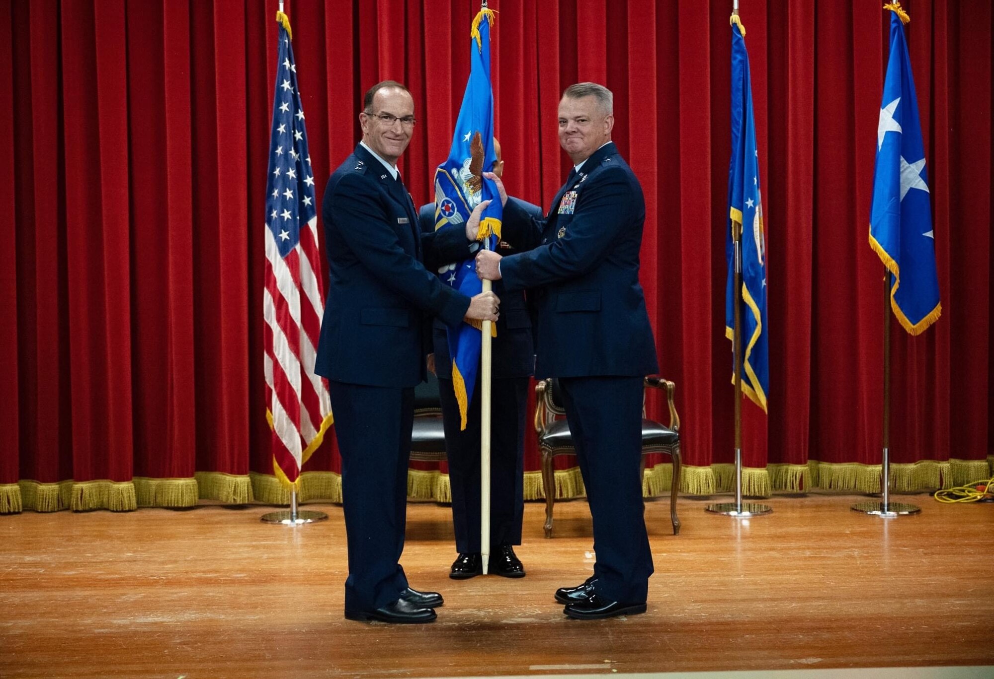 Brig. Gen. Derin S. Durham accepts the Fourth Air Force flag from Lt. Gen. John Healy, Air Force Reserve Command commander and chief of the Air Force Reserve, during an assumption of command ceremony at March Air Reserve Base, California, September 10.
