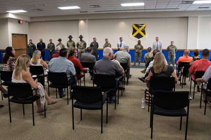 Civic leaders receive a brief