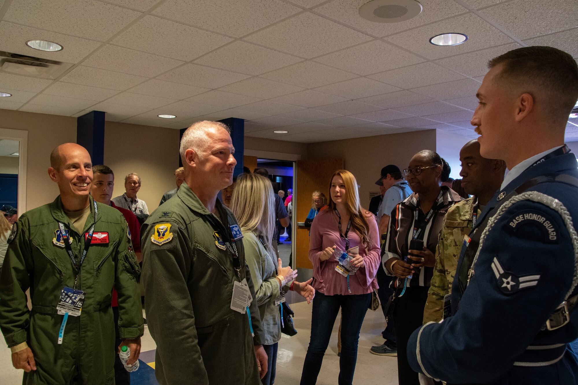 U.S. Air Force Col. Matthew Calhoun, 131st Bomb Wing commander, and Col. Daniel Diehl, 509th Bomb Wing commander, greets Senior Airman Blaske Wilson, Whiteman Air Force Base Honor Guard member, at the Kansas Speedway in Kansas City, Kansas, Sept. 11, 2022. Leaders and Airmen accompany ground crew to flyovers to represent Team Whiteman and tell the Air Force story. (U.S. Air National Guard photo by Airman 1st Class Phoenix Lietch)