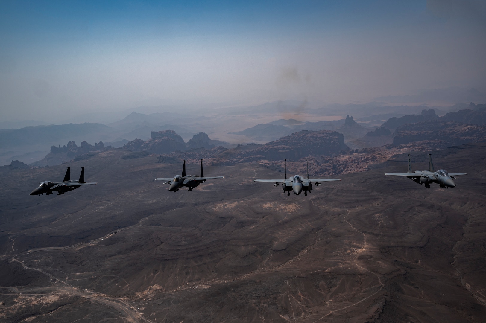 U.S. Air Force F-15E Strike Eagles, assigned to the 335th Expeditionary Fighter Squadron, fly alongside Saudi Arabian Air Force F-15E Strike Eagles during Operation Agile Spartan III within the U.S. Central Command area of responsibility, Sep. 5, 2022. OAS III tested Ninth Air Force (Air Forces Central)’s ability to execute rapid troop and equipment movement to and from dispersed locations around the U.S. Central Command area of responsibility region. This kind of joint training enhances international partnership and interoperability in the interest of regional security. (U.S. Air Force photo by Staff Sgt. Christian Sullivan)