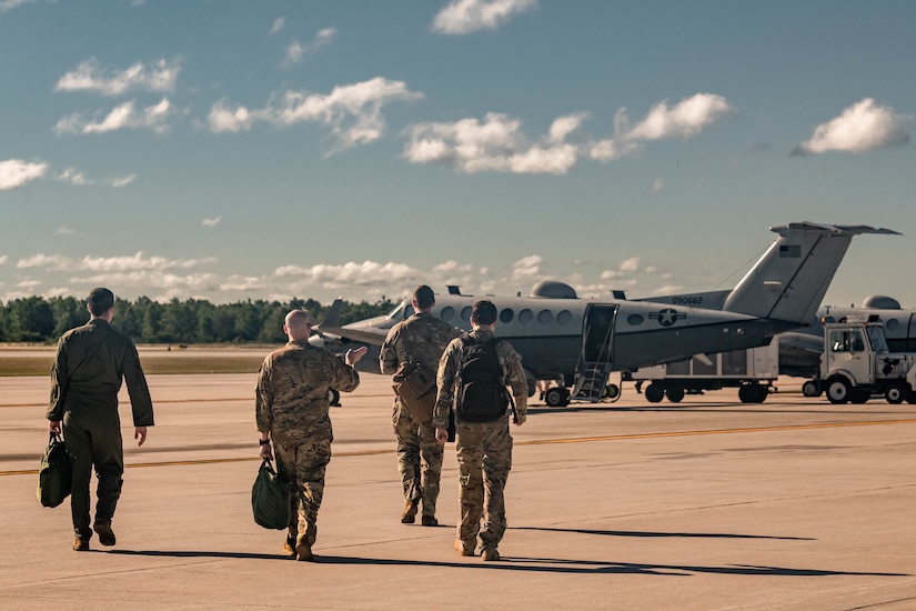 men walking toward aircraft