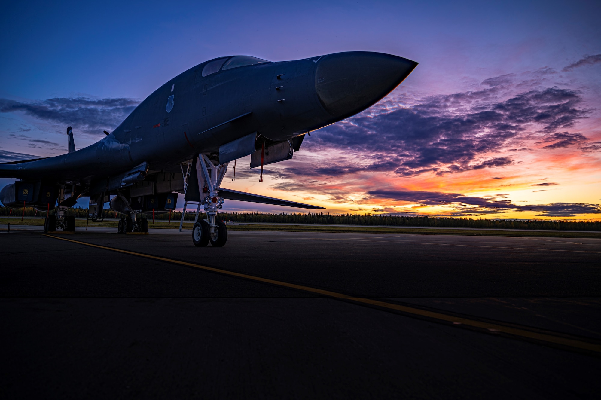 A B-1B Lancer assigned to the 7th Bomb Wing at Dyess Air Force Base, Texas, sits on the flightline at Eielson AFB, Alaska, during the Baked Alaskan exercise, Sept. 9, 2022. Two B-1’s and approximately 50 total force Airmen from the 7th BW and 307th BW engaged in the Agile Combat Employment exercise to refine multiple skills in under 24 hours. (U.S. Air Force photo by Senior Airman Colin Hollowell)