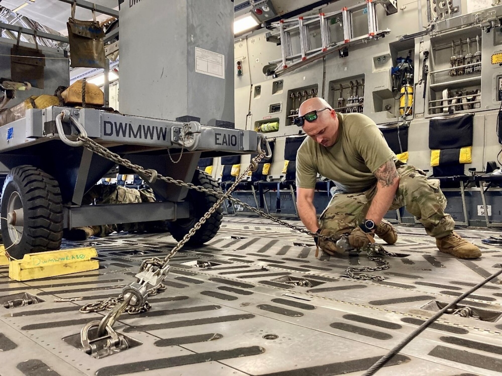 Tech Sgt. Anthony Como, 7 LRS tying secures assets onboard C-17 in preparation for Exercise Baked Alaskan Sep. 9, 2022. (Courtesy Photo)