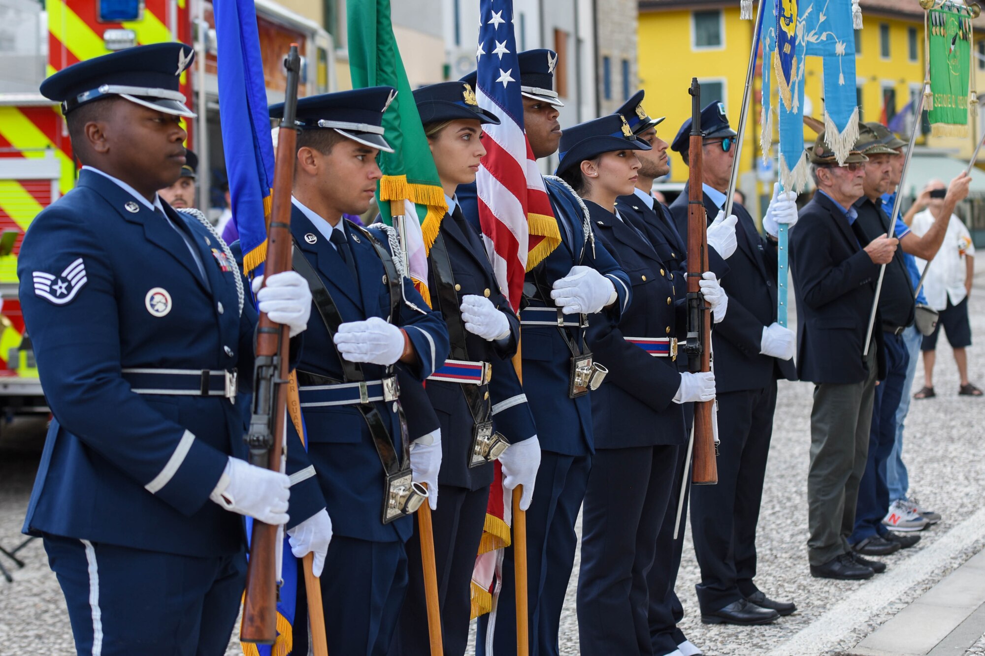 Italian air force and U.S. Air Force honor guard members assigned to Aviano Air Base, Italy, present the colors during the 21st Annual Italian-American Friendship Festival in Roveredo in Piano, Italy, Sept. 10, 2022. During the festival, a memorial ceremony, various entertainment and sports tournaments were held between teams from the 31st Fighter Wing, Italian Air Force, Roveredo Municipality, and Pordenone Fire Department. (U.S. Air Force photo by Senior Airman Brooke Moeder)