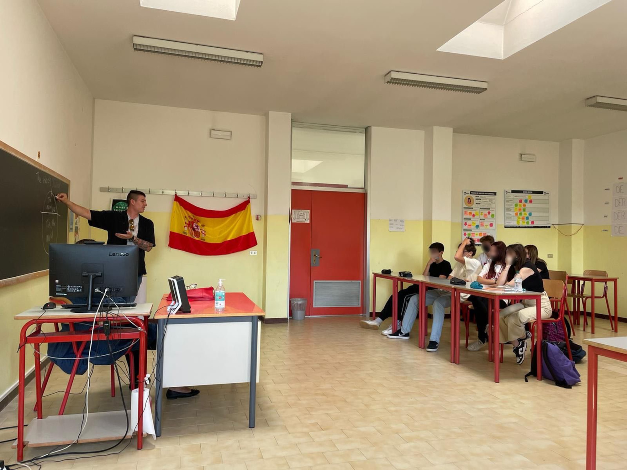 Airman 1st Class Conner Randolph, Vicini Americani English Teaching Program volunteer, teaches English to a high school class in a local city near Aviano Air Base, Italy. During the 2021-2022 school year, more than 49 volunteers taught 226 hours of English and some Spanish to 700 high school and middle school students over the course of 61 classes in a local city. The program is scheduled to continue into the 2022-2023 school year with plans to also reach elementary schools. (U.S. Air Force photo by Senior Airman Brooke Moeder)