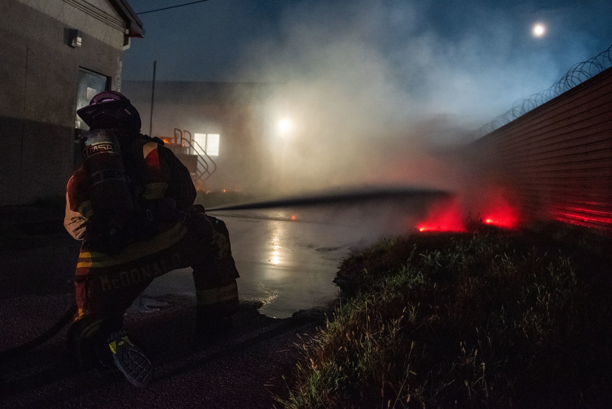 U.S. Air Force Senior Airman Corey McDonald, 51st Civil Engineer Squadron lead firefighter, extinguishes a simulated fire during a fire response scenario at Osan Air Base, Republic of Korea, Sept. 12, 2022, in support of a wing training event.