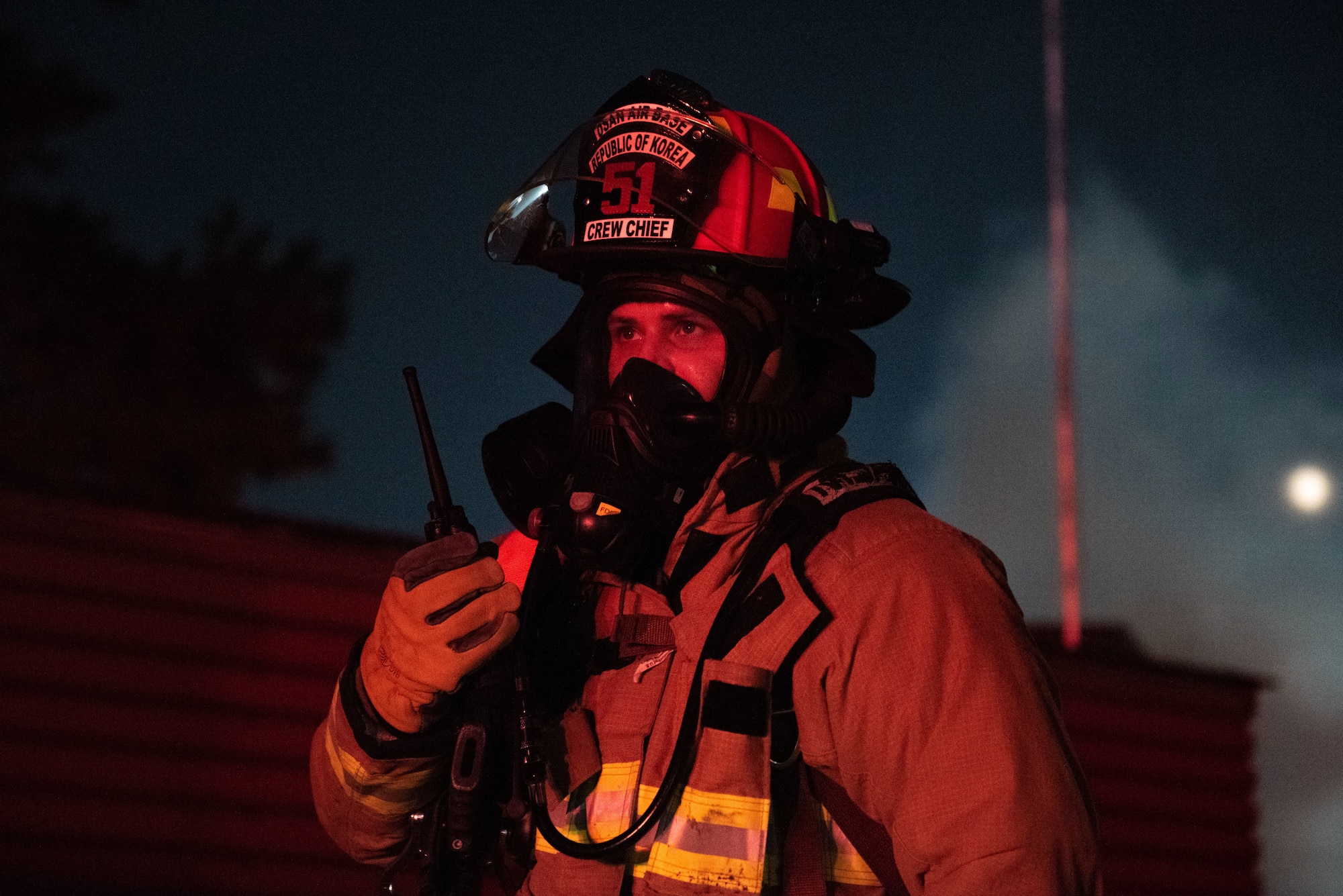 U.S. Air Force Staff Sgt. Benny Bowen, 51st Civil Engineer Squadron lead firefighter, responds to radio traffic during a fire response scenario at Osan Air Base, Republic of Korea, Sept. 12, 2022, in support of a wing training event.
