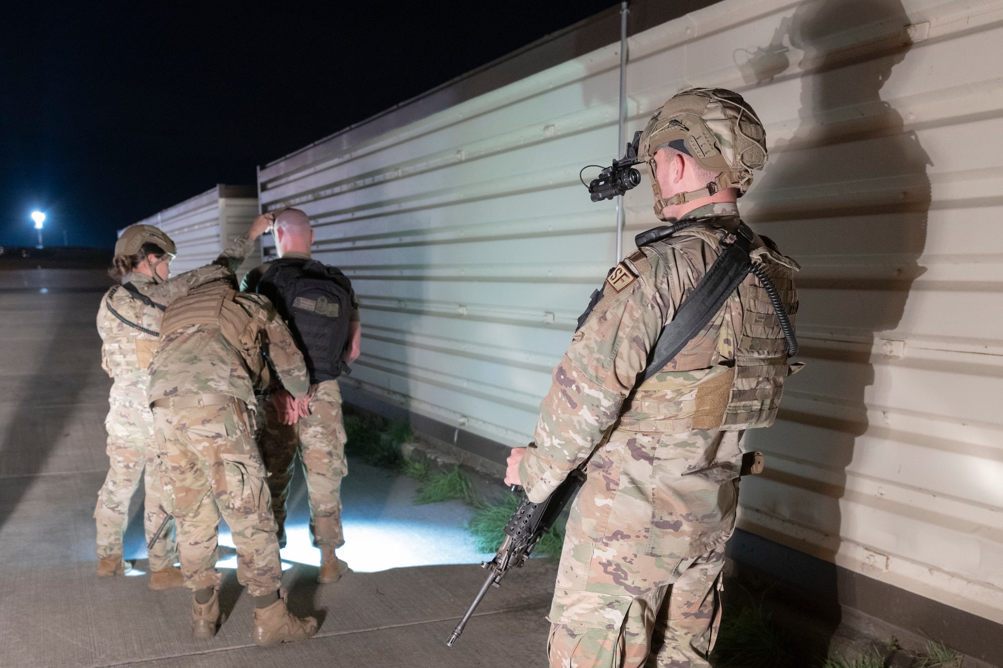 Airmen detain a simulated suspect.