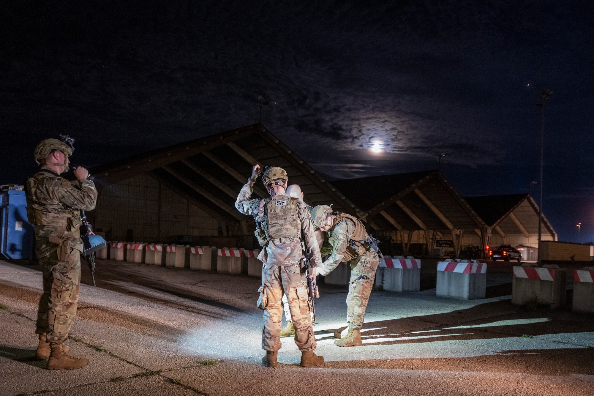 Airmen search a simulated suspect.