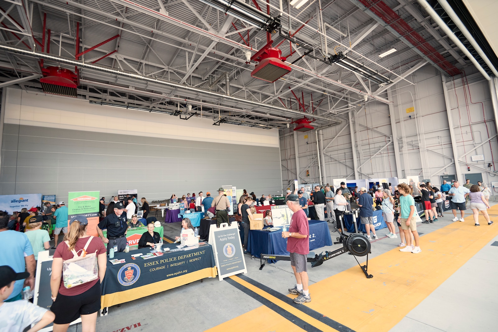 Photo of more than 6,000 visitors at the open house hosted by the Vermont Air and Army National Guard, where military aviation, equipment, vehicles, munitions and flight simulators were on display, along with a career fair, musical performances and police dog demonstrations, at the Vermont Air National Guard Base, South Burlington, Vermont, Sept. 11, 2022.