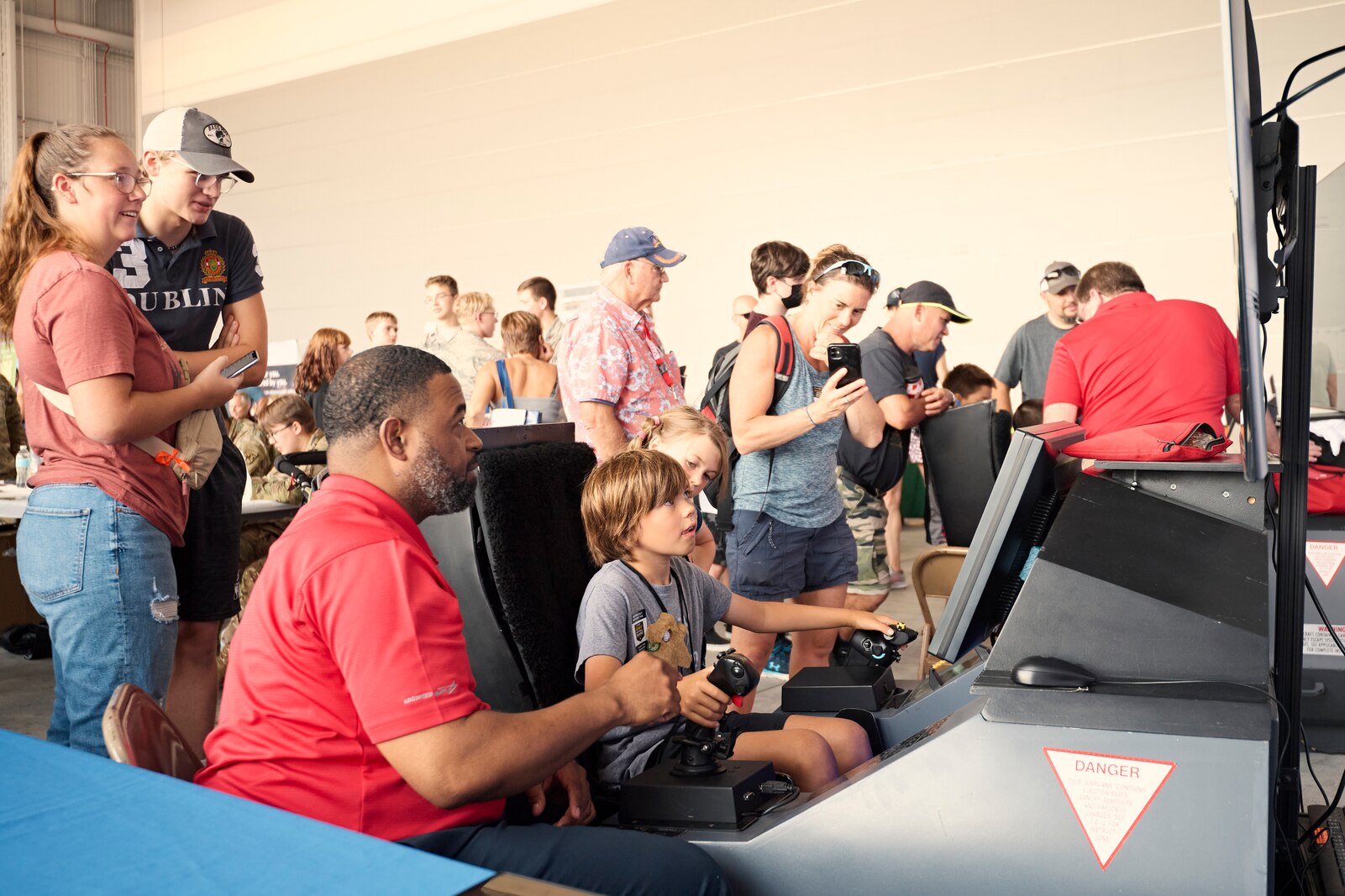 Photo of more than 6,000 visitors at the open house hosted by the Vermont Air and Army National Guard, where military aviation, equipment, vehicles, munitions and flight simulators were on display, along with a career fair, musical performances and police dog demonstrations, at the Vermont Air National Guard Base, South Burlington, Vermont, Sept. 11, 2022.