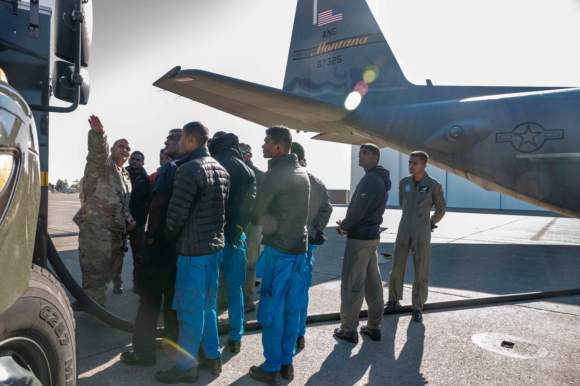 Master Sgt. Mark Payton, 120th Logistics Readiness Squadron, aircraft fuels technician, briefs Sri Lanka Air Force members on aircraft refueling procedures at the Montana Air National Guard Base, Great Falls, Montana, Sept. 9, 2022.