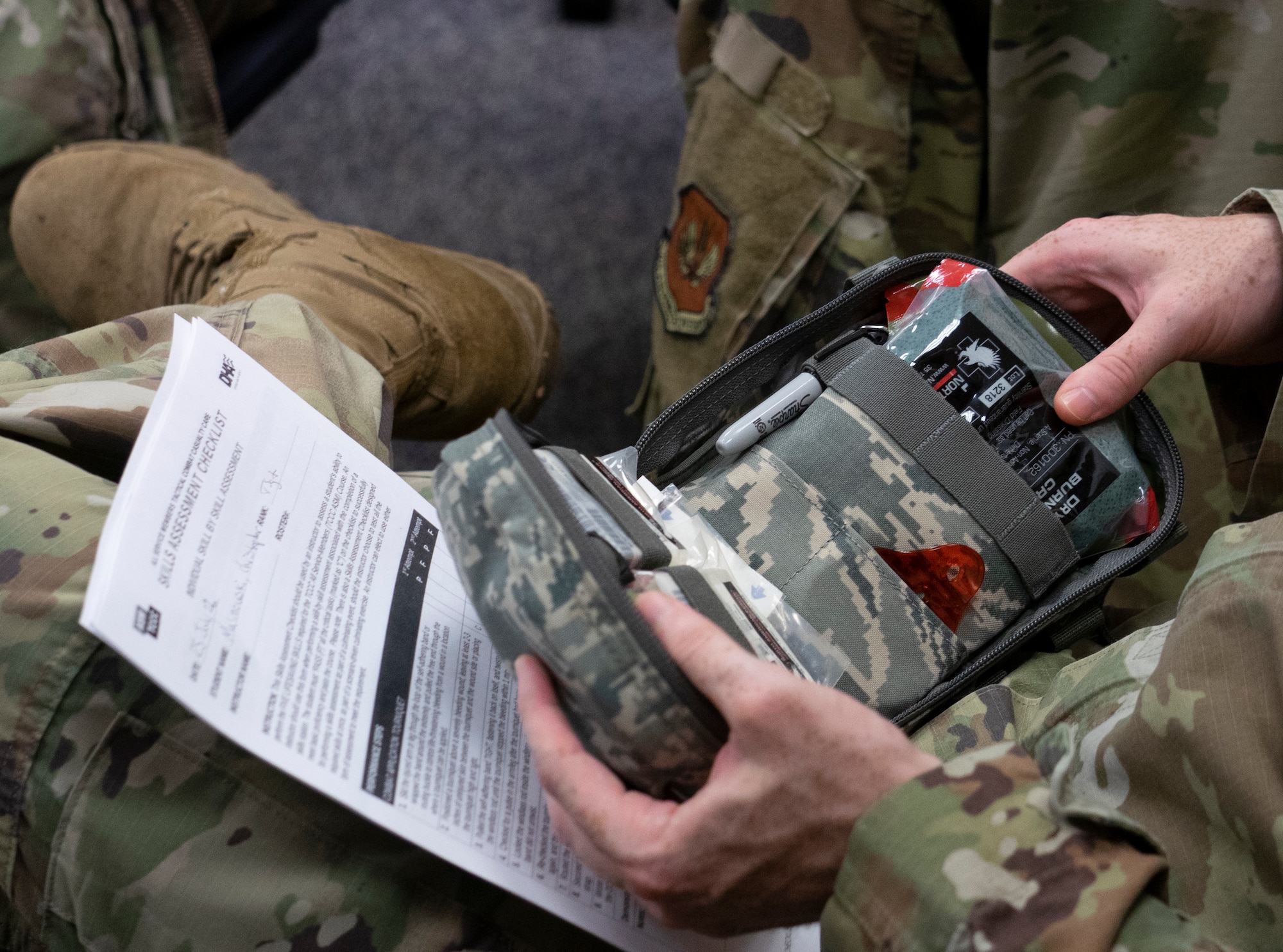 man looks at first-aid kit