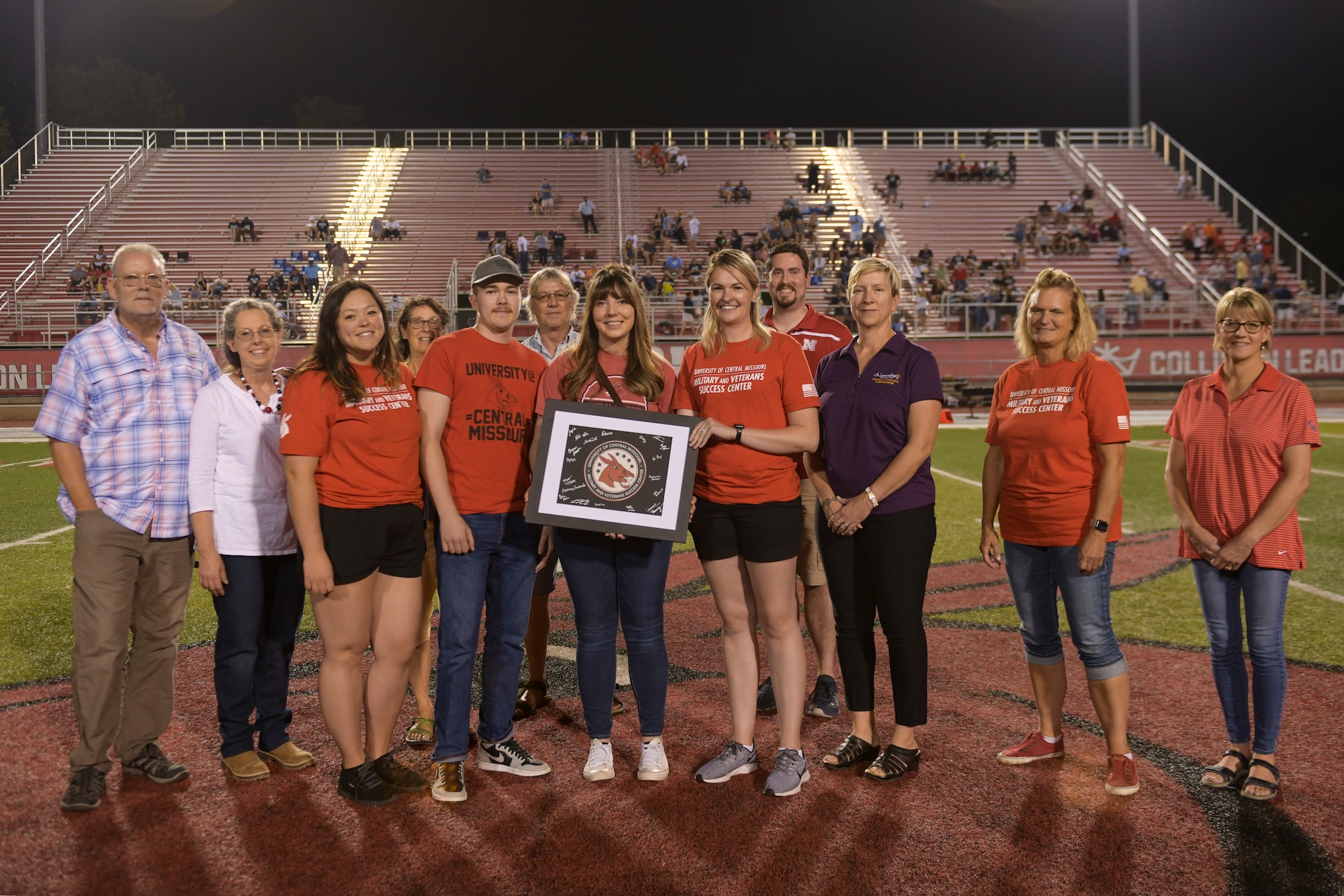 U.S. Air Force Staff Sgt. Natalie Rhinehart, 442nd Logistics Readiness Squadron unit training manager, is recognized by the University of Central Missouri Military and Veterans Success Center during halftime of the UCM Military Appreciation football game, Sept. 8, 2022, in Warrensburg, Missouri. Whiteman AFB and UCM share a valuable community partnership that fosters a supportive relationship between the base and local communities. (U.S. Air Force photo by Tech. Sgt. Dylan Nuckolls)