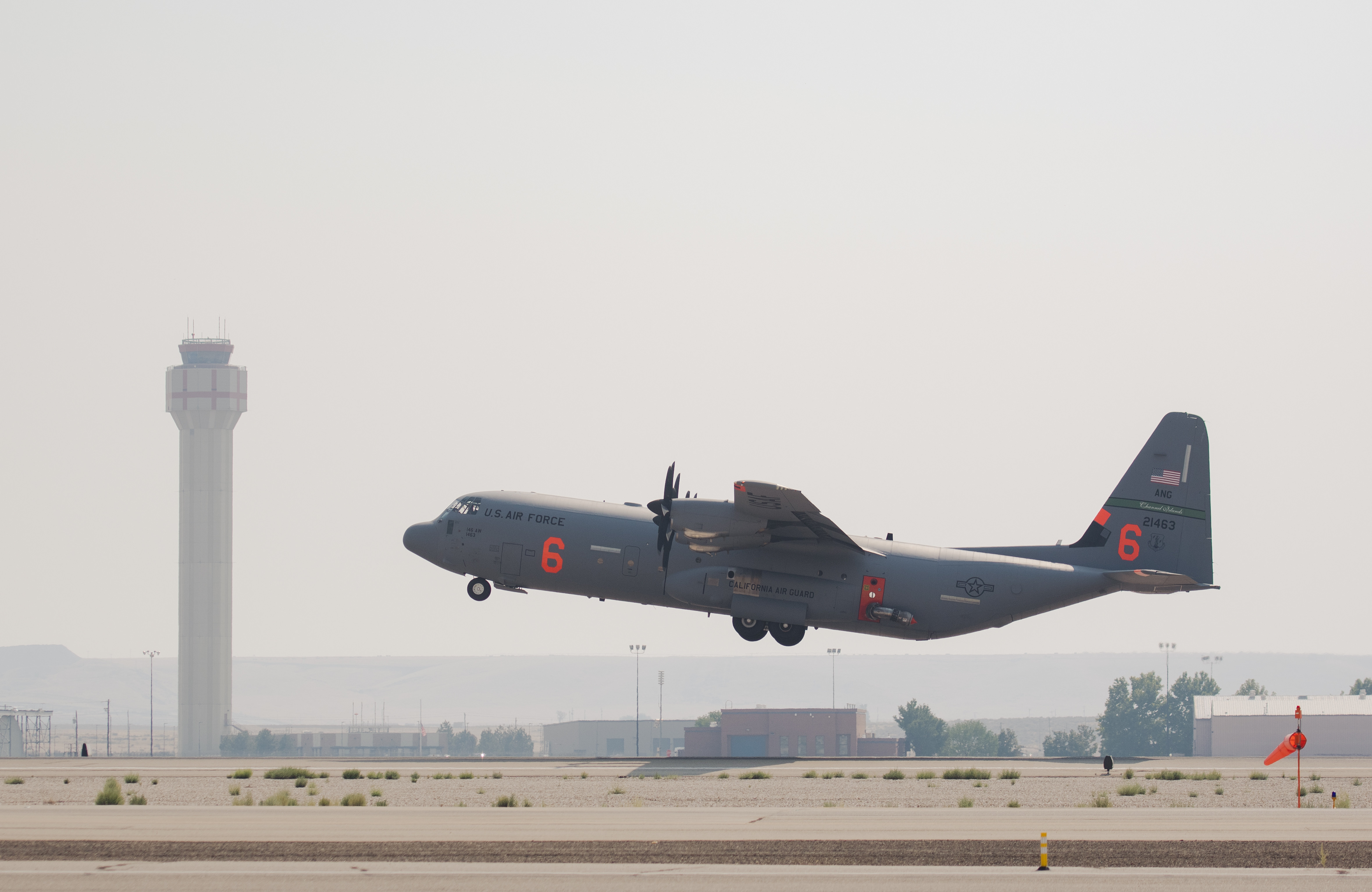 MAFFS-enabled C-130 aircraft assisting fire suppression
