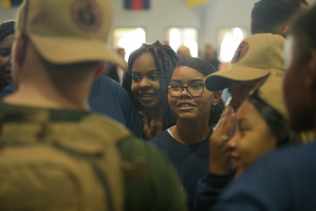 RIO DE JANEIRO (Sept. 12, 2022) A local Brazilian girl talks with a U.S. Marine from 4th Civil Affairs Group, during a community relations event during UNITAS LXIII, Sept. 12, 2022. UNITAS is the world’s longest-running maritime exercise. Hosted this year by Brazil, it brings together multinational forces from Belize, Brazil, Cameroon, Chile, Colombia, Dominican Republic, Ecuador, France, Guyana, Jamaica, Mexico, Namibia, Panama, Paraguay, Peru, South Korea, Spain, United Kingdom, Uruguay, and the United States conducting operations in and off the coast of Rio de Janeiro. The exercise trains forces to conduct joint maritime operations through the execution of anti-surface, anti-submarine, anti-air, amphibious and electronic warfare operations that enhance warfighting proficiency and increase interoperability among participating naval and marine forces. (U.S. Marine Corps photo by Cpl. Ethan Craw/Released)