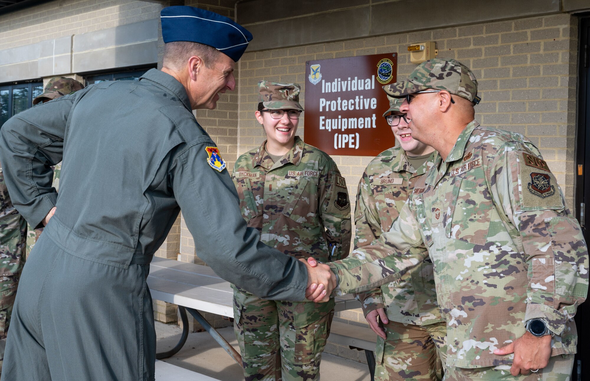 Senior Master Sgt. Michael Sierra, 436th Logistics Readiness Squadron flight superintendent, right, greets Maj. Gen. Corey Martin, 18th Air Force commander, left, during his visit to Dover Air Force Base, Delaware, Sept. 13, 2022. Martin experienced Dover’s unique mission by touring the C-5 Isochronal Inspection Dock, 436th Aerial Port Squadron and 436th LRS. (U.S. Air Force photo by Senior Airman Cydney Lee)