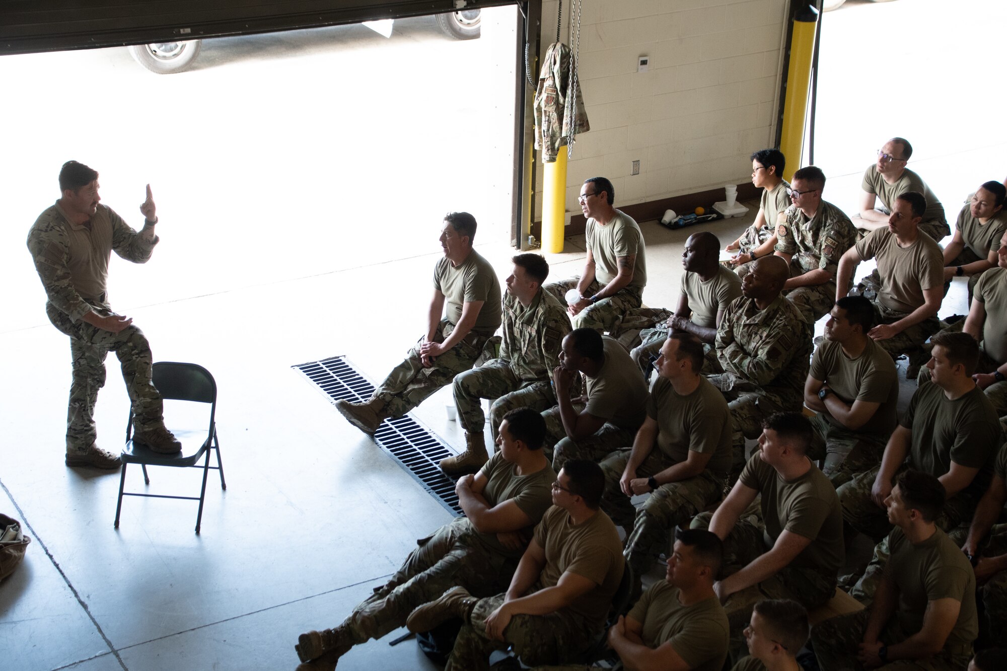 Members with the 221st and 239th Combat Communications Squadrons receive instruction on Tactical Combat Casualty Care from Staff Sgt. Travis Wilson, 159th Fighter Wing, during Exercise BUMBU 22 at Camp Shelby, Mississippi, June 9, 2022. BUMBU 22 is a training exercise involving five geographically-separated combat communications squadrons from across the 254th Combat Communications Group. (U.S. Air National Guard photo by Airman 1st Class Kelly Ferguson)