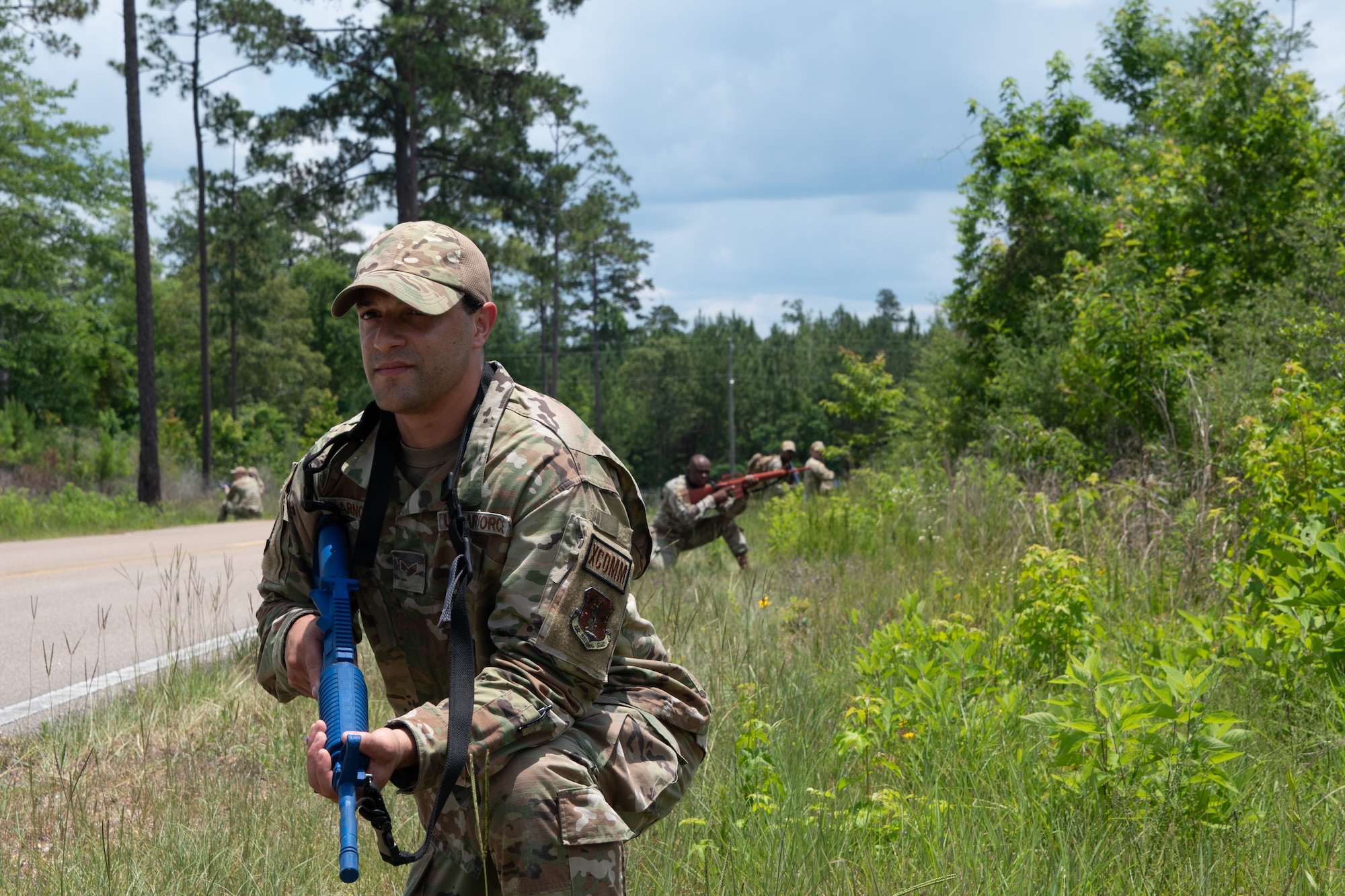 Senior Airman Joshua Arnold, 239th Combat Communications Squadron, keeps watch while on a patrol during Exercise BUMBU 22 at Camp Shelby, Mississippi, June 7, 2022. BUMBU 22 is a training exercise involving five geographically-separated combat communications squadrons from across the 254th Combat Communications Group. (U.S. Air National Guard photo by Staff Sgt. Adrian Brakeley)