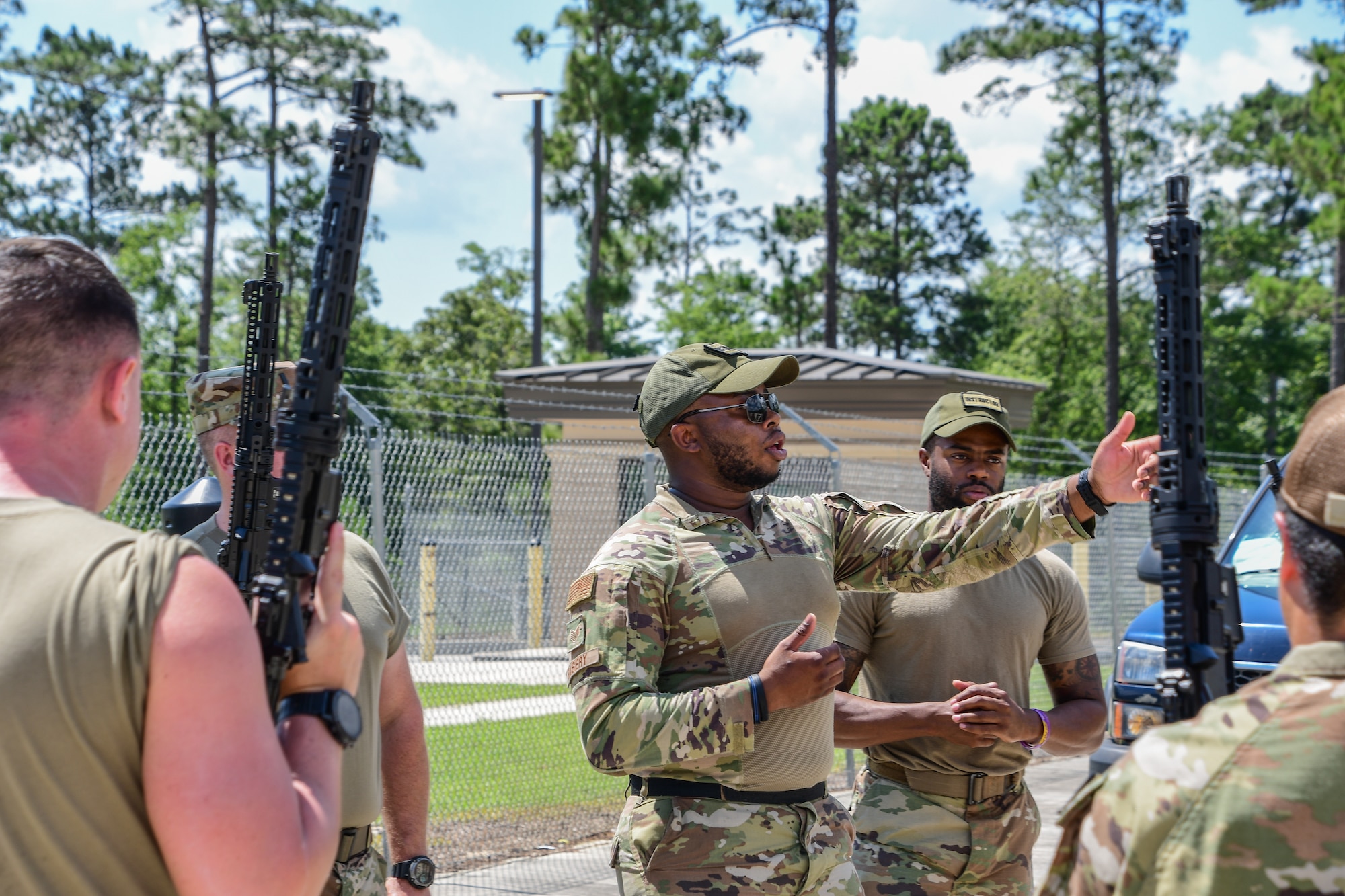 Instructors with the 159th Fighter Wing instruct Tactical Combat Casualty Care and countermeasure maneuvers during Exercise BUMBU 22 at Camp Shelby, Mississippi, June 6, 2022. BUMBU 22 is a training exercise involving five geographically-separated combat communications squadrons from across the 254th Combat Communications Group. (U.S. Air National Guard photo by Staff Sgt. Adrian Brakeley)