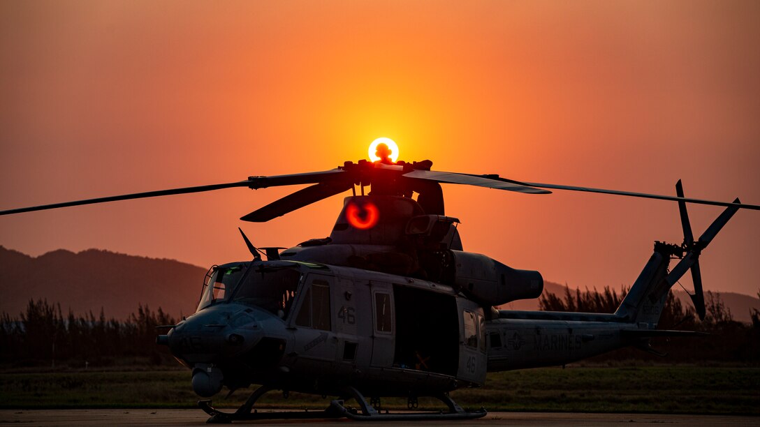 U.S. Marine Corps aircraft maintainers with Marine Light Attack Helicopter Squadron - 773, 4th Marine Aircraft Wing, Marine Forces Reserve, in support of Special Purpose Marine Air-Ground Task Force UNITAS LXIII, conduct preventative maintenance on a UH-1Y Venom at São Pedro da Aldeia, Brazil, during exercise UNITAS LXIII, Sept. 8, 2022. UNITAS is the world's longest-running annual multinational maritime exercise that focuses on enhancing interoperability among multiple nations and joint forces during littoral and amphibious operations in order to build on existing regional partnerships and create new enduring relationships that promote peace, stability and prosperity in the U.S. Southern Command’s area of responsibility. (U.S. Marine Corps photo by 1st Lt. Mark L. Andries)