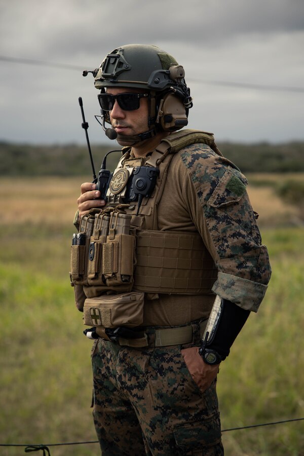 U.S. Marine Corps Gunnery Sgt. Julio Arias with 4th Air Naval Gunfire Liaison Company, Marine Forces Reserve, in support of Special Purpose Marine Air-Ground Task Force UNITAS LXIII, monitors his headset during call for fire drills as part of exercise UNITAS LXIII at São Pedro da Aldeia, Brazil, Sept. 5, 2022. Marine Light Attack Helicopter Squadron (HMLA) 773 and 4th ANGLICO cross trained with the Brazilian Marine Corps by conducting simulated close air support drills, which consists of locating targets from the ground and relaying coordinates to assets in the sky to destroy. UNITAS trains forces to conduct joint maritime operations through the execution of anti-surface, anti-submarine, anti-air, amphibious and electronic warfare operations that enhance warfighting proficiency and increase interoperability among participating naval and marine forces. (U.S. Marine Corps photo by Cpl. Colton K. Garrett)