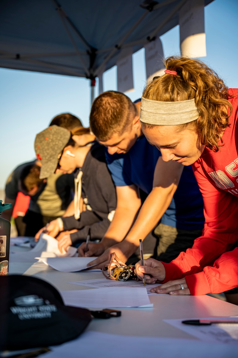 Community members sign in to take part in Run for the Fallen during a 9/11 remembrance event Sept. 9, 2022, at Wright-Patterson Air Force Base, Ohio. The run was held to honor those killed during the Sept. 11 terrorist attacks. (U.S. Air Force photo by Hannah Carranza)
