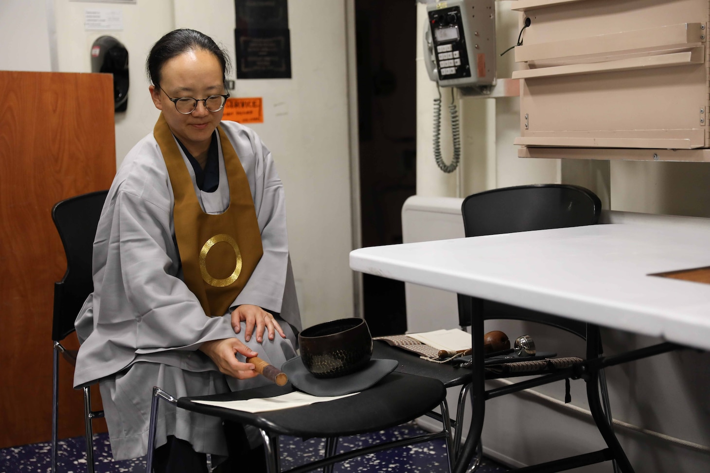 ATLANTIC OCEAN (Sept. 11, 2022) U.S. Navy Chaplain Lt. Saejeong Kim performs a Buddhist Dharma service onboard the guided-missile destroyer USS McFaul (DDG 74), Sept. 11. Kim was commissioned as a Navy Chaplain in 2017 and currently serves with Destroyer Squadron 2 as the only active-duty Buddhist chaplain in the U.S. Navy. (U.S. Navy photo by Mass Communication Specialist 3rd Class Kerri Kline)