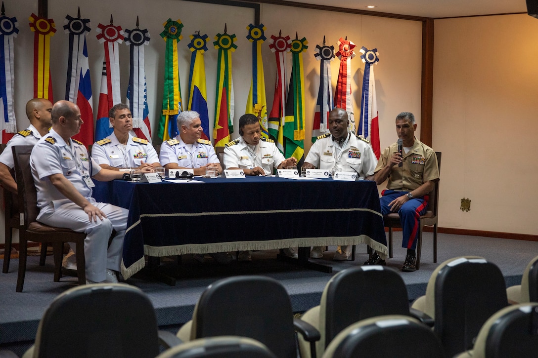 U.S. Marine Corps Col. Guillermo Rosales, commander of Special Purpose Marine Air-Ground Task Force UNITAS LXIII, speaks with Brazilian Navy leadership during a press conference after the opening ceremony of exercise UNITAS LXIII in Rio de Janeiro, Sept. 8, 2022. The opening ceremony recognized the official start of exercise UNITAS LXIII. UNITAS is the world's longest-running annual multinational maritime exercise that brings together forces from 19 countries to include Brazil, Cameroon, Chile, Colombia, Dominican Republic, Ecuador, France, Guyana, Jamaica, Mexico, Namibia, Panama, Paraguay, Peru, South Korea, Spain, United Kingdom, Uruguay, and the United States. The exercise focuses on enhancing interoperability among multiple nations and joint forces during littoral and amphibious operations in order to build on existing regional partnerships and create new enduring relationships that promote peace, stability and prosperity in the U.S. Southern Command’s area of responsibility. (U.S. Marine Corps photo by Sgt. Camila Melendez)
