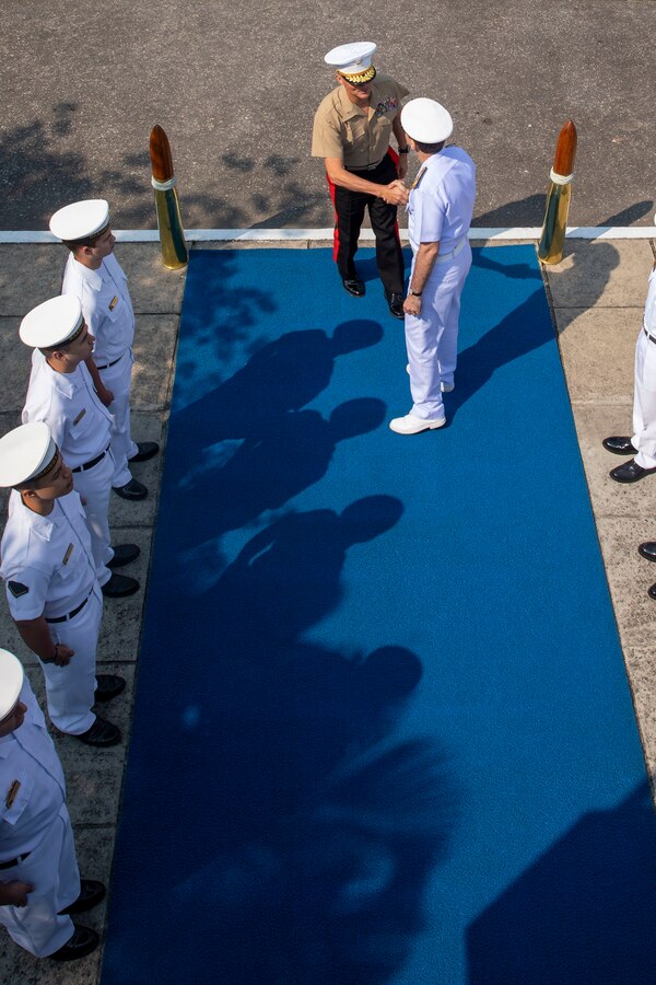 U.S. Marine Corps Brig. Gen. Len “Loni” Anderson, commanding general of 4th Marine Aircraft Wing, Marine Forces Reserve, shakes hands with Vice-Almirante Arthur Fernando Bettega Correa (Brazilian Navy), commander in chief of the Brazilian fleet, while being welcomed to the opening ceremony of exercise UNITAS LXIII in Rio de Janeiro, Sept. 8, 2022. The opening ceremony recognized the official start of exercise UNITAS LXIII. UNITAS is the world's longest-running annual multinational maritime exercise that brings together forces from 19 countries to include Brazil, Cameroon, Chile, Colombia, Dominican Republic, Ecuador, France, Guyana, Jamaica, Mexico, Namibia, Panama, Paraguay, Peru, South Korea, Spain, United Kingdom, Uruguay, and the United States. The exercise focuses on enhancing interoperability among multiple nations and joint forces during littoral and amphibious operations in order to build on existing regional partnerships and create new enduring relationships that promote peace, stability and prosperity in the U.S. Southern Command’s area of responsibility. (U.S. Marine Corps photo by Sgt. Camila Melendez)